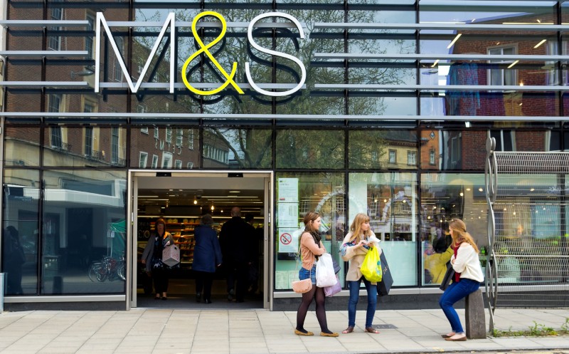 Norwich, England - May 17, 2012: Shoppers inside and outside M+S (Marks + Spencer) in Norwich. Marks + Spencer was founded in 1894 by Michael Marks and Tom Spencer as a penny bazaar. It has now grown to become a great British institution with around 700 stores in the UK and over 300 in 40 other countries. It specialises in clothing and good quality food with other departments selling furniture and household items.