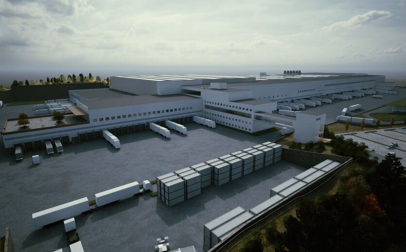 Großes automatisiertes Logistikzentrum mit Lagerhallen und Lkw Ladezonen.